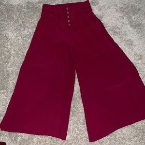 Loose high waisted flared red dress pants.